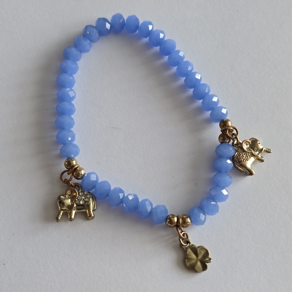 Elephant bracelet blue beads stretch gold tone shamrock 4 leaf clover